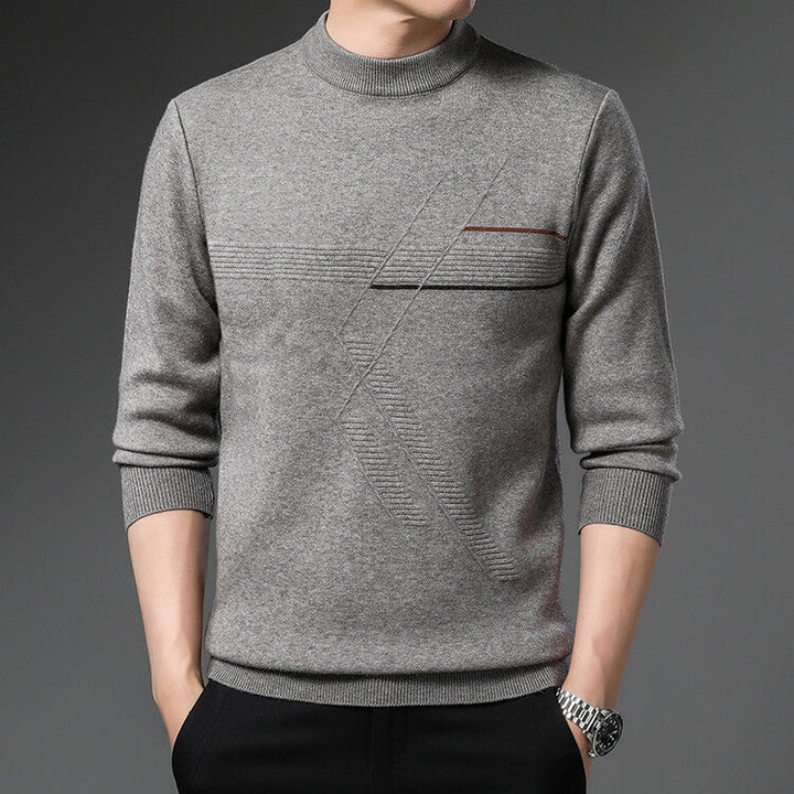 Maglione grigio uomo, design moderno con dettagli geometrici, collo alto, maniche lunghe. Moda maschile elegante, abbigliamento autunnale.